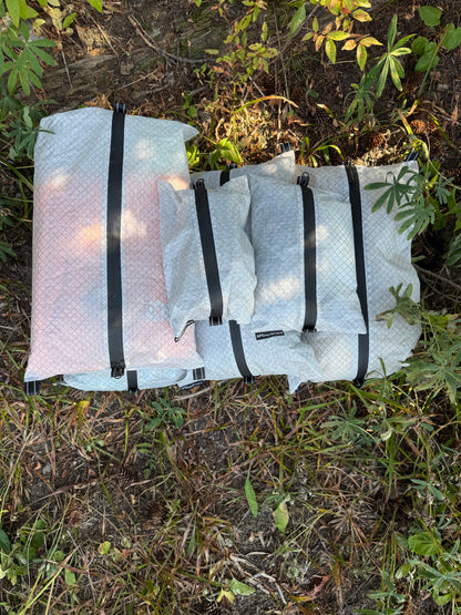 Folded camping mattress on grass