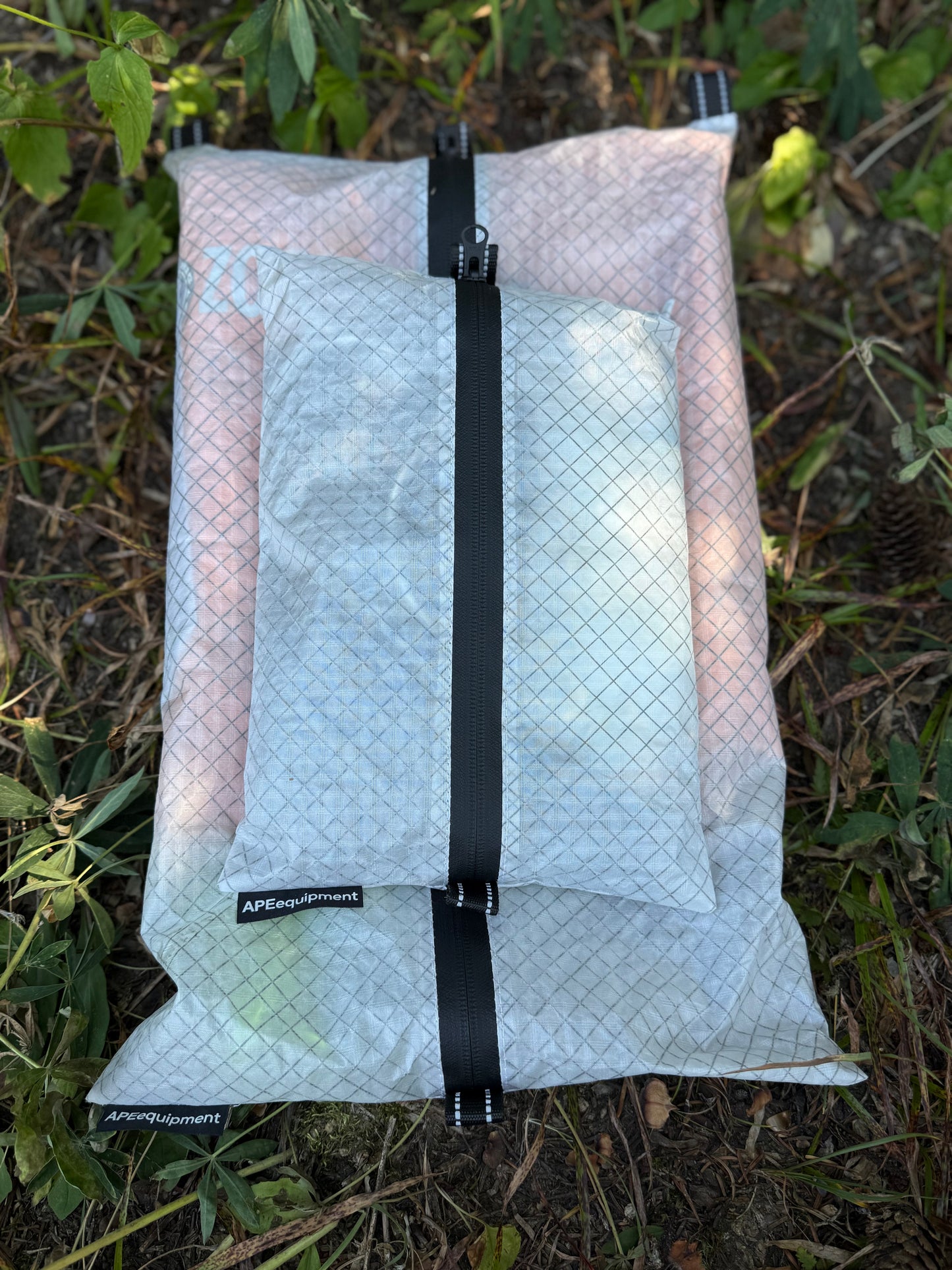 Packaged product with a black strap on a grassy background