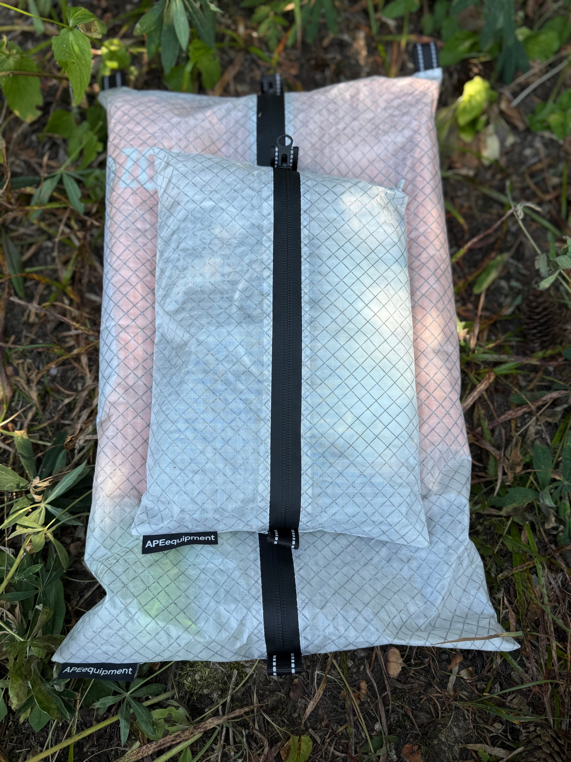 Packaged product with a black strap on a grassy background