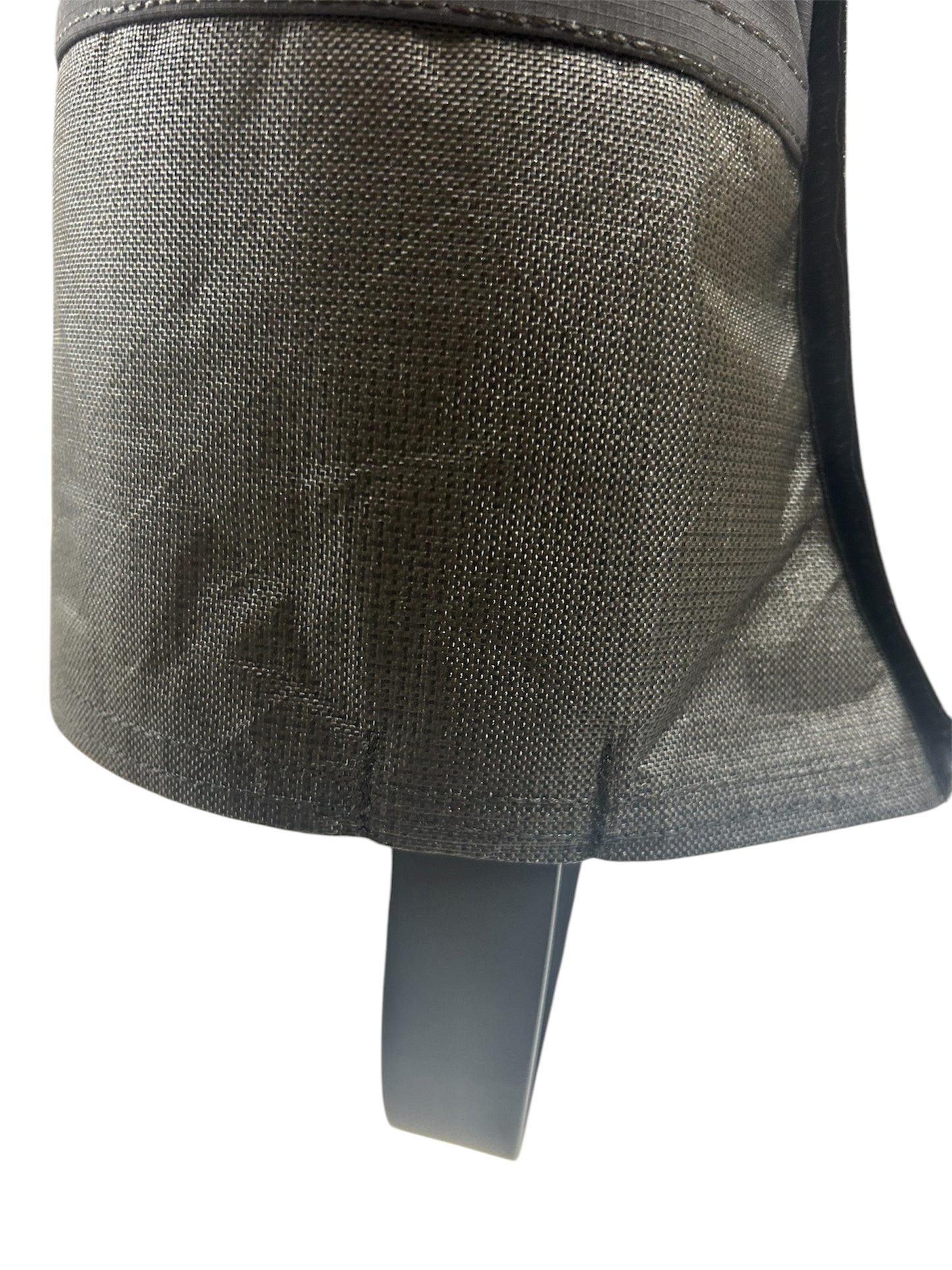 Close-up of a textured gray fabric pocket on a white background