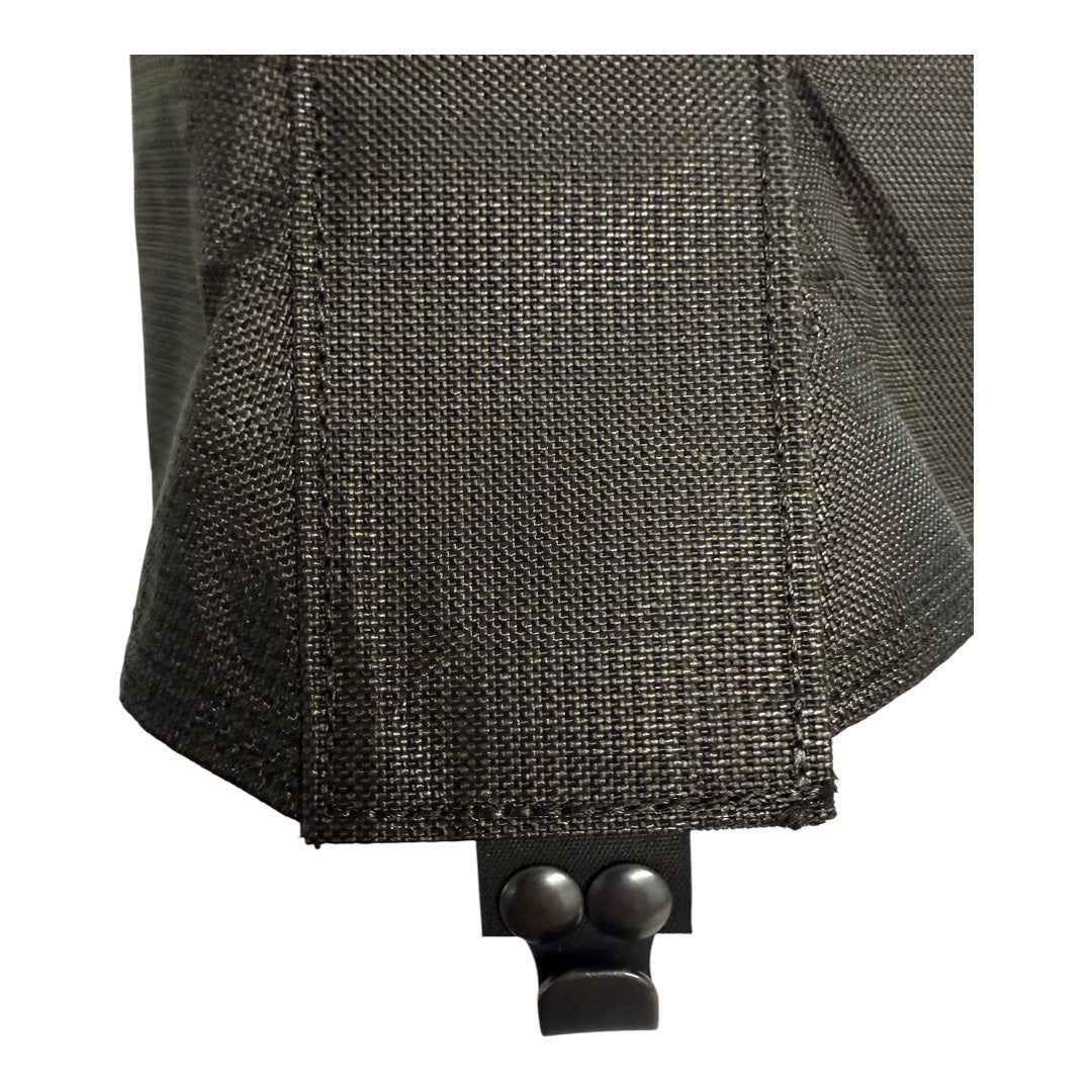 Close-up of a black tactical pouch with a button on a white background